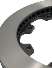 Load image into Gallery viewer, Zoomed picture of a brake rotor showing internal cooling vanes and mounting tabs
