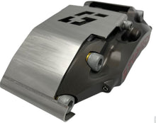 Load image into Gallery viewer, A brake caliper with a stainless steel guard mounted to it on a white background