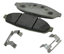 Load image into Gallery viewer, 2 Crown Vic brake pads with pad shims in the foreground

