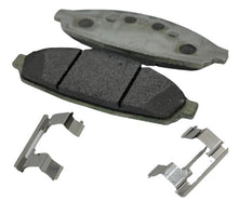 Load image into Gallery viewer, 2 Crown Vic brake pads with pad shims in the foreground