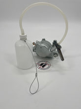 Load image into Gallery viewer, Brake bleeder bottle with hose connected via socket to a brake caliper
