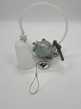 Load image into Gallery viewer, Brake bleeder bottle with hose connected via socket to a brake caliper
