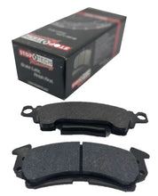 Load image into Gallery viewer, Black brake pad box in the background with 2 separate brake pads in the foreground on a white background