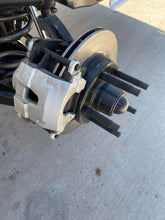 Load image into Gallery viewer, A hub rotor installed on a dirt modified showing the brake caliper

