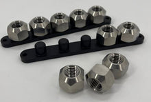 Load image into Gallery viewer, Various titanium lug nuts mounted on a black aluminum lug nut plate
