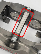 Load image into Gallery viewer, Brake caliper picture with a red box to highlight the pad retaining tube

