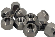 Load image into Gallery viewer, A group or pile of 10 titanium lug nuts on a white background
