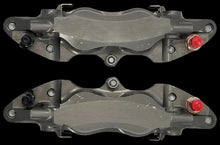 Load image into Gallery viewer, Two metallic brake calipers on a white background
