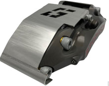 Load image into Gallery viewer, A brake caliper with a stainless steel guard mounted to it on a white background
