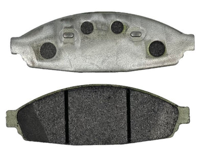 Two Crown Vic brake pads - one shot of the front and one of the backside of the pads