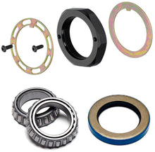 Load image into Gallery viewer, Collection of mechanical bearings and components on a white background
