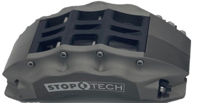Hard anodized StopTech 6-piston trophy truck brake caliper on a white background