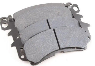 Four brake pads on a white background