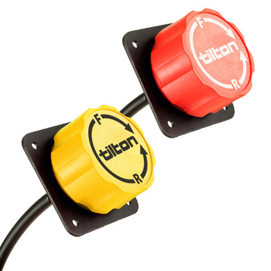 A red and a yellow Tilton brake bias adjuster knob on a white background