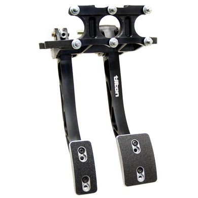 A clutch and brake pedal assembly on a white background