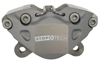 Side shot of a StopTech ST23 caliper on a white background