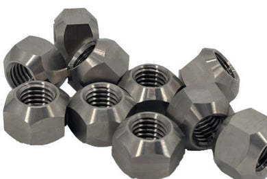 A group or pile of 10 titanium lug nuts on a white background