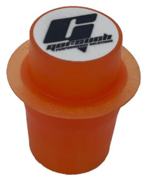 An orange transmission tailhousing plug with a Gorsuch logo on top on a white background